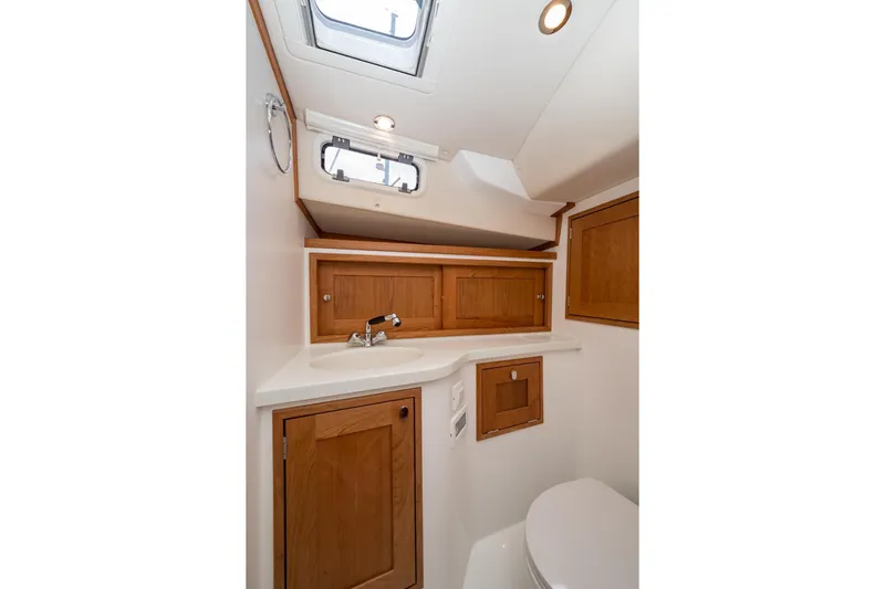 Slide: The Image of 2025 MJM 35 yacht bathroom with wooden cabinets and modern fixtures. - 36