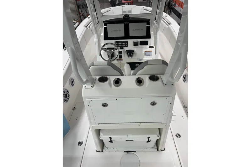Slide: The Image of 2024 Sea Fox 288 Commander boat cockpit with Garmin displays and steering wheel. - 7