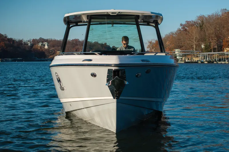 Slide: The Image of 2026 Monterey Elite 30 OB boat on a serene lake with autumn trees. - 10