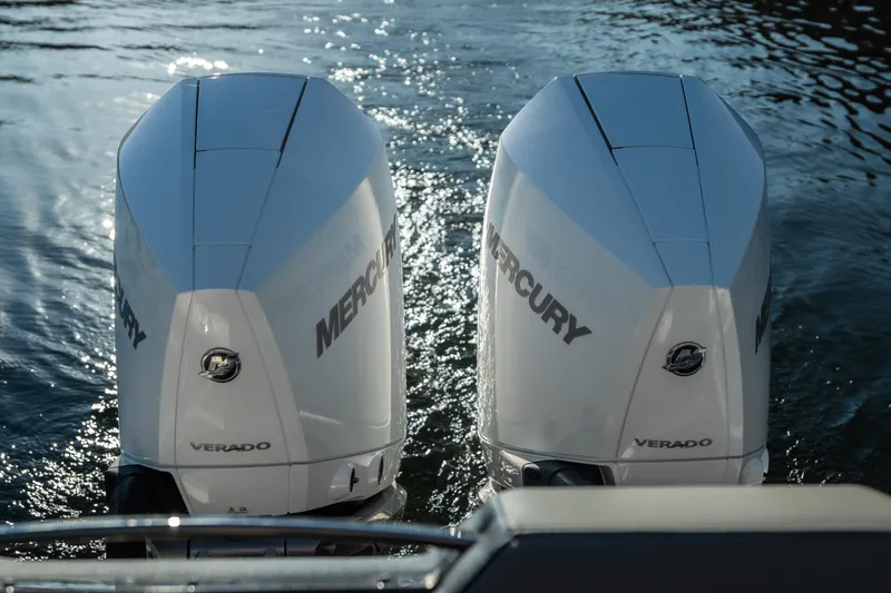 Slide: The Image of Twin Mercury Verado outboard engines on a 2026 Monterey Elite 30 OB boat. - 21