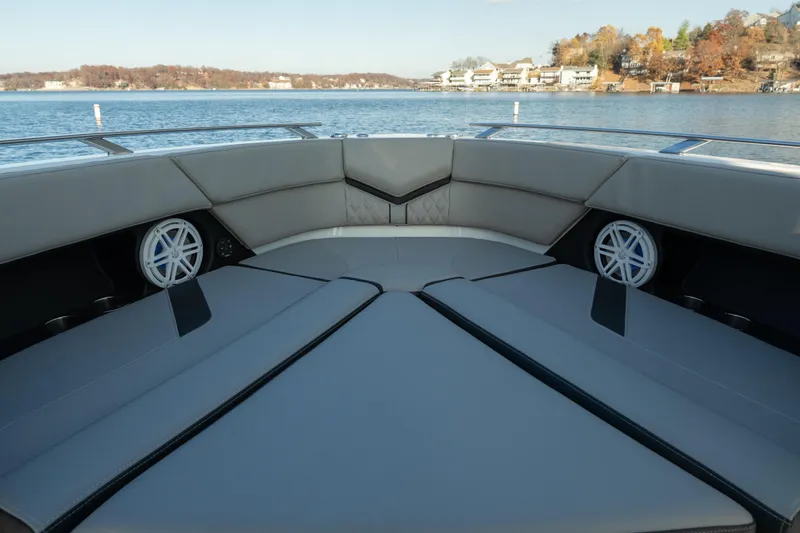 Slide: The Image of Luxurious seating on 2026 Monterey Elite 30 OB boat, with scenic lake view. - 25