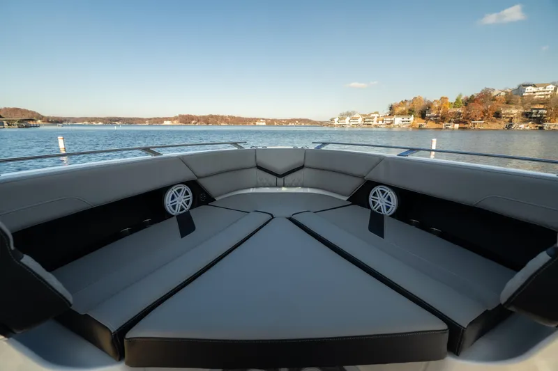 Slide: The Image of Luxurious seating on 2026 Monterey Elite 30 OB boat with scenic lake view. - 27