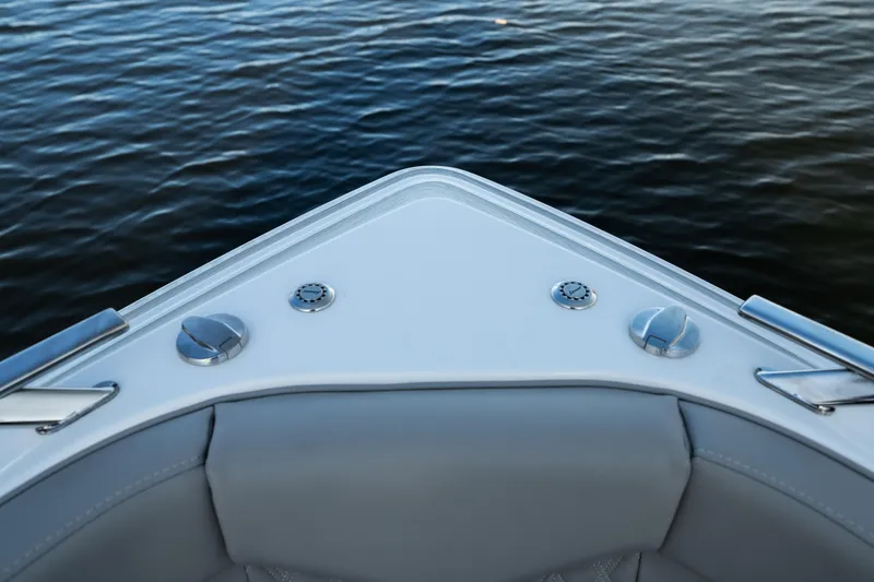 Slide: The Image of Bow of 2026 Monterey Elite 30 OB boat on calm water. - 28
