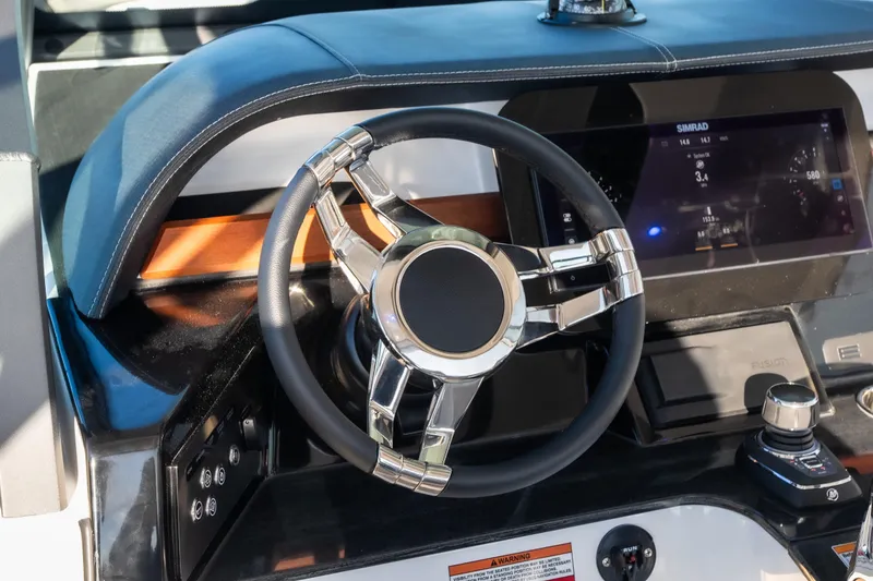 Slide: The Image of Steering wheel and dashboard of 2026 Monterey Elite 30 OB boat. - 35