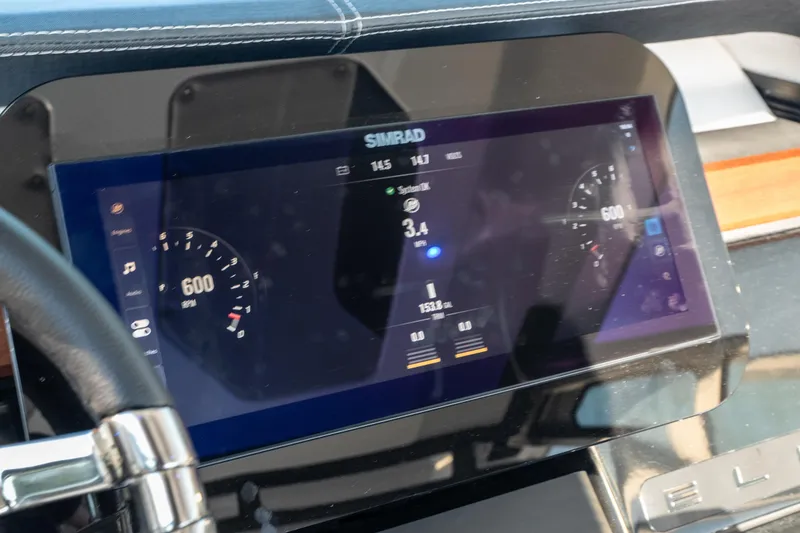 Slide: The Image of Dashboard of 2026 Monterey Elite 30 OB boat with Simrad display. - 37