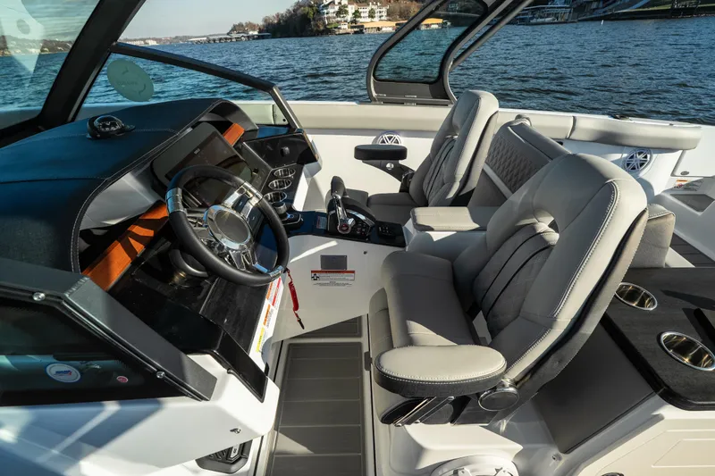 Slide: The Image of 2026 Monterey Elite 30 OB boat interior with modern steering and seating. - 41
