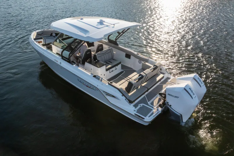 Slide: The Image of 2026 Monterey Elite 30 OB boat on water, featuring sleek design and powerful Mercury engines. - 7