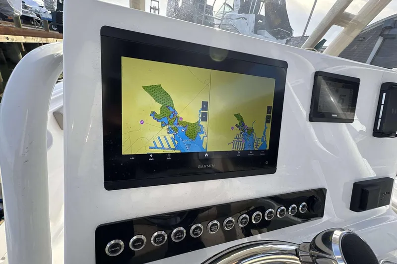 Slide: The Image of 2024 Key West 239 FS boat dashboard with Garmin navigation display. - 11