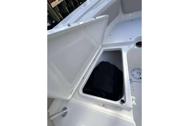 Slide: The Image of Open storage compartment on 2024 Key West 239 FS boat deck. - 13