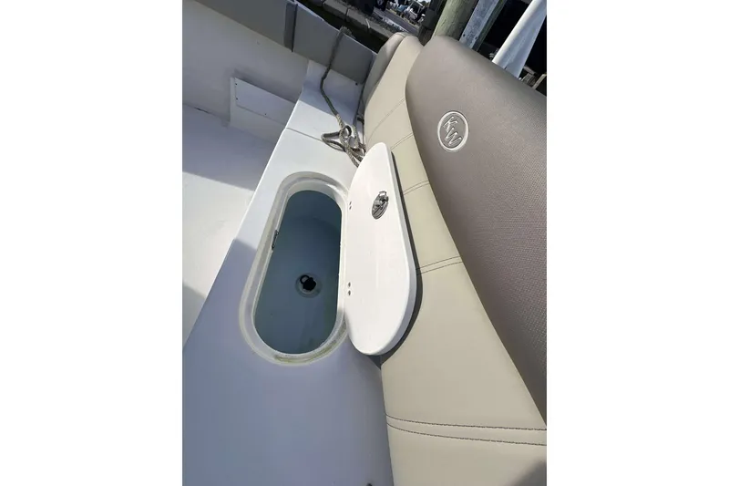 Slide: The Image of 2024 Key West 239 FS boat interior with open storage compartment. - 16