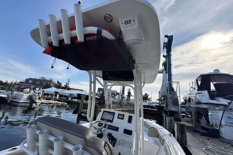 Slide: The Image of 2024 Key West 239 FS boat docked at marina under a cloudy sky. - 20