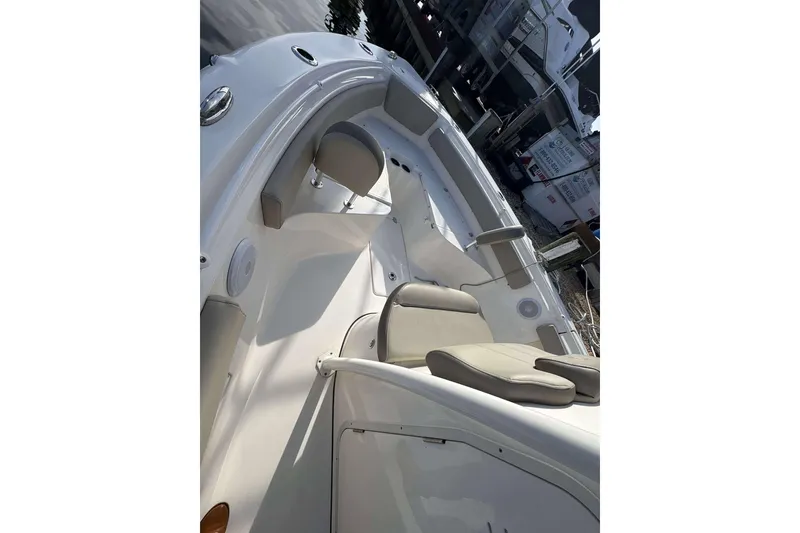 Slide: The Image of 2024 Key West 239 FS boat interior with seating and storage compartments. - 7
