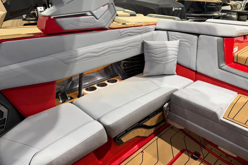 Slide: The Image of Luxurious interior of 2026 Nautique Super Air Nautique G23 with red and gray seating. - 12