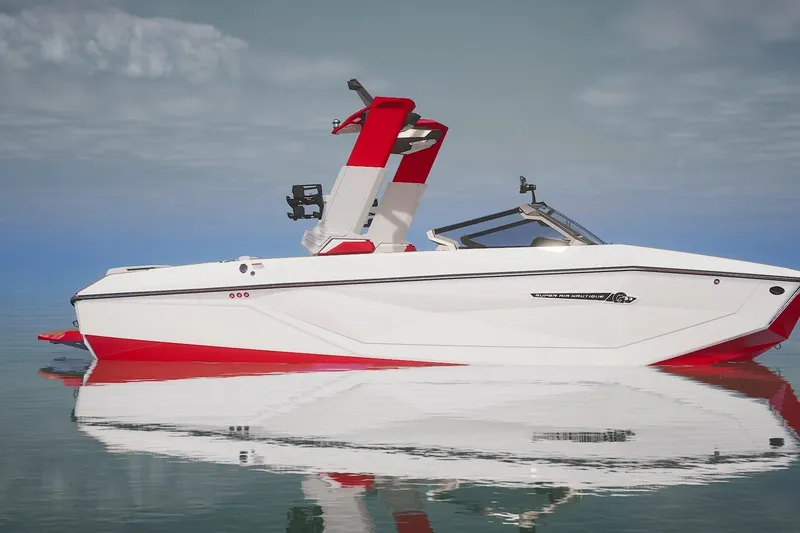 Slide: The Image of 2026 Nautique Super Air Nautique G23 interior with red and gray seating, wooden flooring. - 2