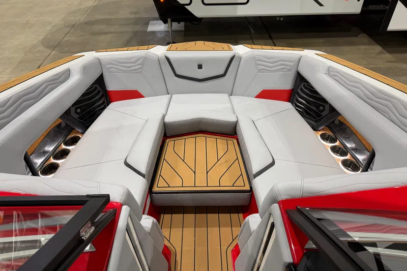 Slide: The Image of 2026 Nautique Super Air Nautique G23 boat interior with luxurious seating and cup holders. - 6
