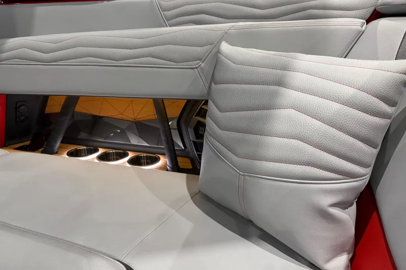 Slide: The Image of 2026 Nautique Super Air Nautique G23 interior with luxurious seating and cup holders. - 9