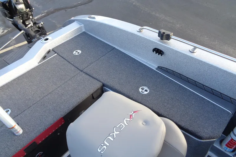 Slide: The Image of 2022 Vexus DVX22 boat interior with gray seating and storage compartments. - 10