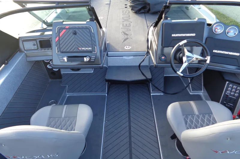 Slide: The Image of 2022 Vexus DVX22 boat interior with dual seats and Humminbird electronics. - 12