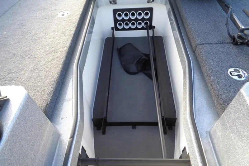 Slide: The Image of 2022 Vexus DVX22 boat interior storage compartment with rod holders. - 13