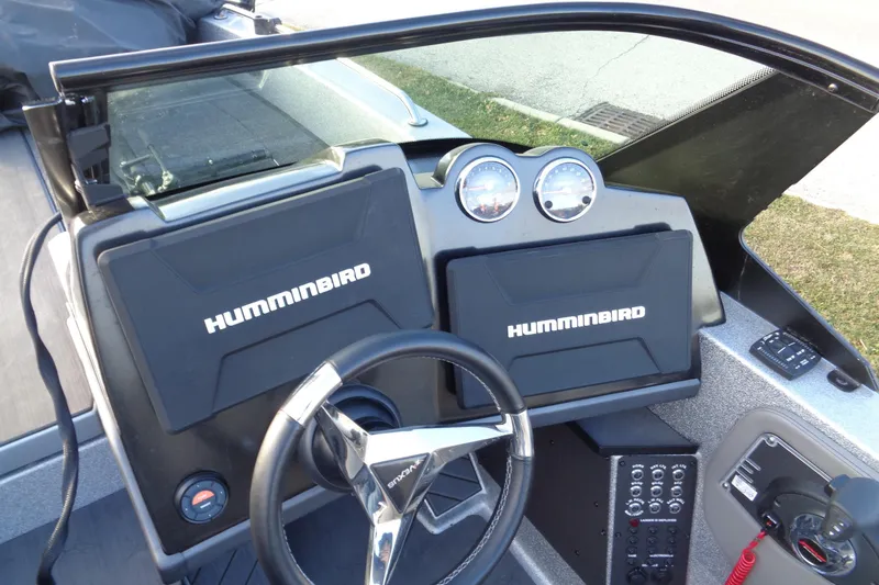 Slide: The Image of 2022 Vexus DVX22 boat dashboard with Humminbird electronics and steering wheel. - 6