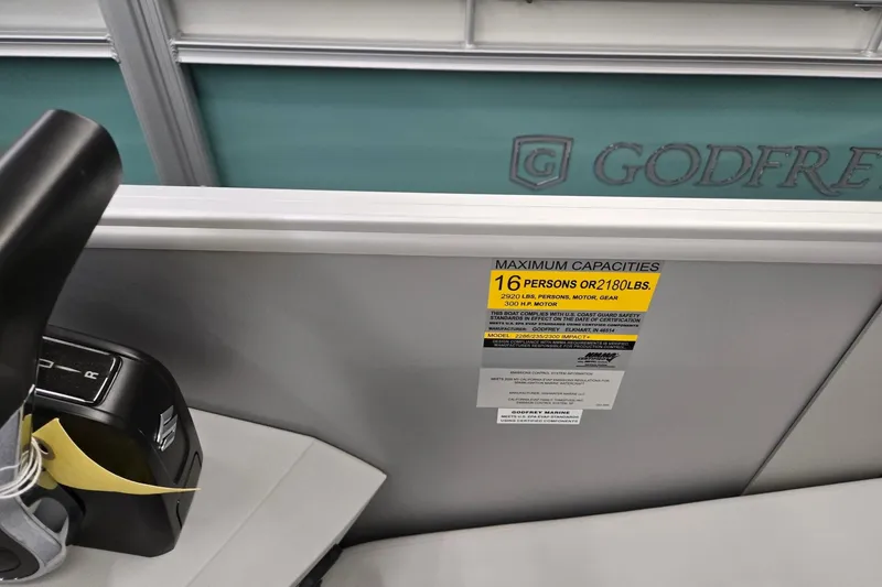 Slide: The Image of 2026 Godfrey Sweetwater 2286 FS boat capacity label, seating for 16, 2180 lbs limit. - 11