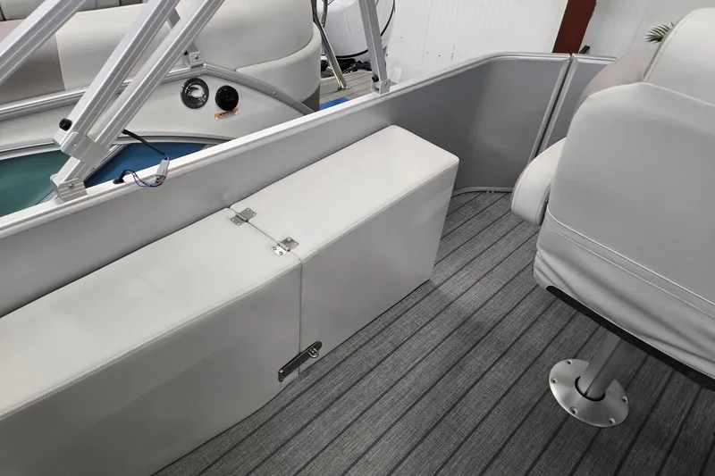 Slide: The Image of 2026 Godfrey Sweetwater 2286 FS interior with gray seating and striped flooring. - 13