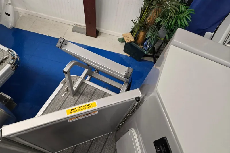 Slide: The Image of 2026 Godfrey Sweetwater 2286 FS boat gate with safety warning label. - 18