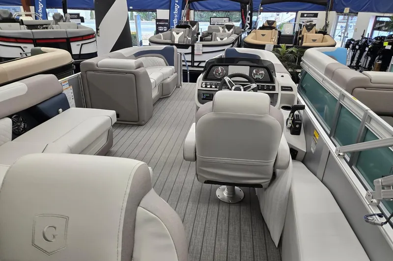 Slide: The Image of Interior of 2026 Godfrey Sweetwater 2286 FS pontoon boat with luxurious seating and modern dashboard. - 19