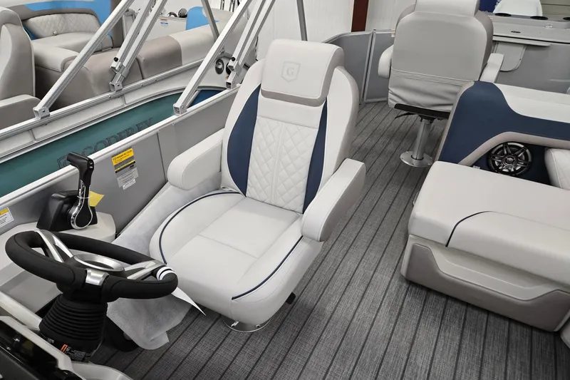Slide: The Image of 2026 Godfrey Sweetwater 2286 FS boat interior with luxurious seating and modern steering console. - 7