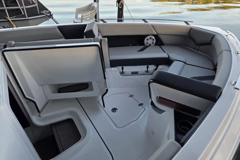 Slide: The Image of 2026 Monterey Elite 30 OB boat interior with sleek seating and storage compartments. - 4