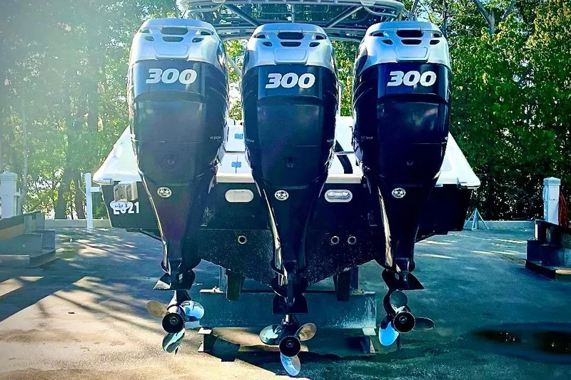 Slide: The Image of 2013 Midnight Express 39S Open with triple 300 horsepower engines, docked outdoors. - 11