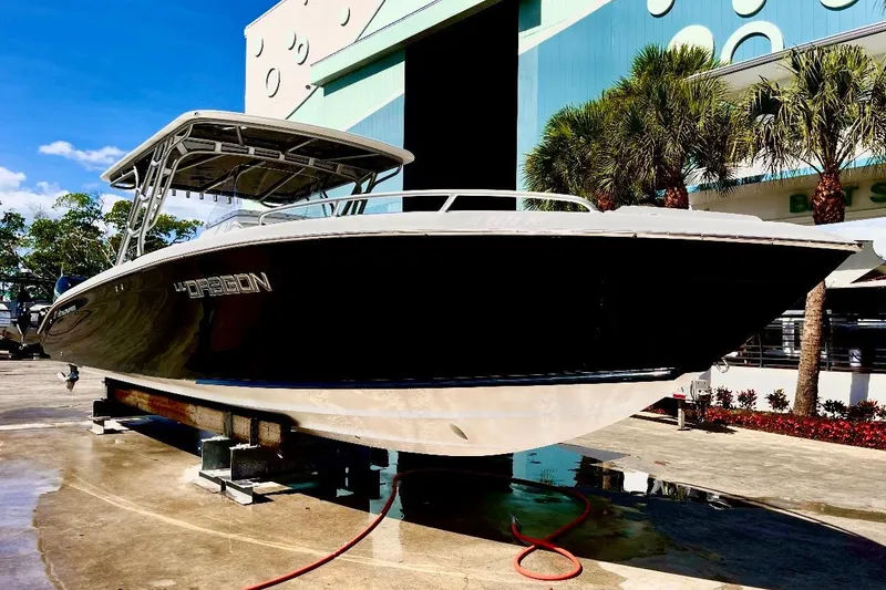 Slide: The Image of 2013 Midnight Express 39S Open boat on display, sleek design, outdoor setting. - 3