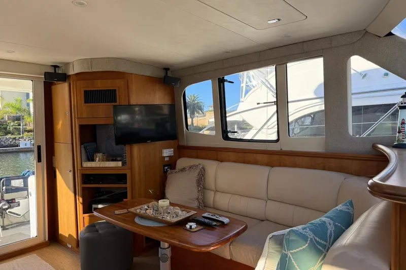 Slide: The Image of Luxurious interior of 2003 Silverton 38 Convertible yacht with cozy seating and modern amenities. - 12