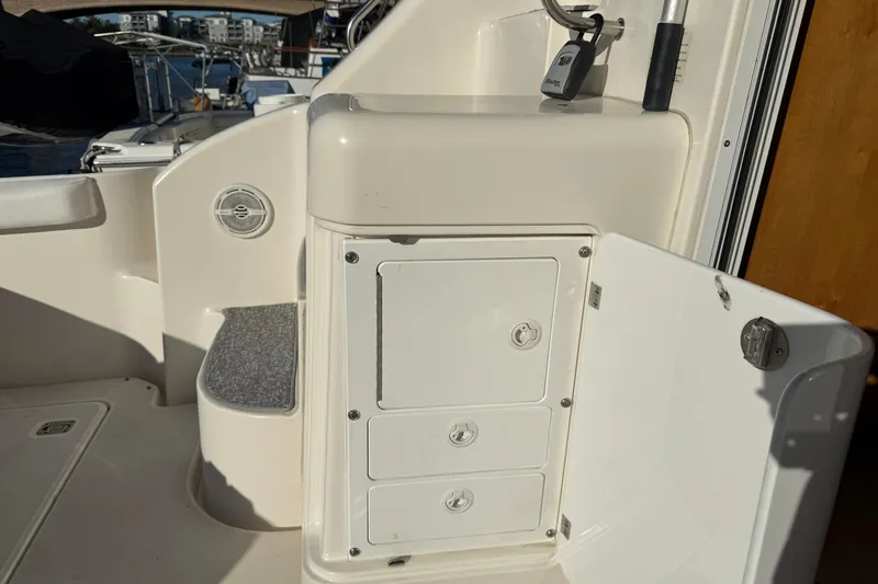 Slide: The Image of 2003 Silverton 38 Convertible boat interior with storage compartments and marine equipment. - 33