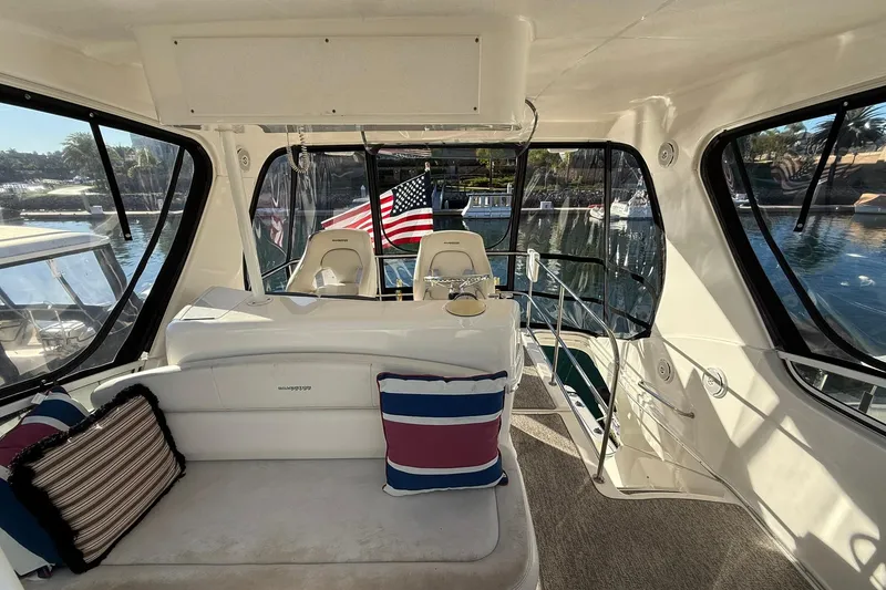 Slide: The Image of Interior of 2003 Silverton 38 Convertible yacht with seating and American flag. - 37