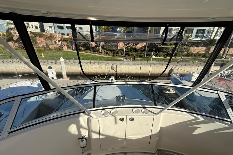 Slide: The Image of 2003 Silverton 38 Convertible yacht cockpit view at marina dock. - 38