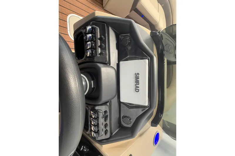 Slide: The Image of 2026 Bentley Pontoons Elite 223 Swingback dashboard with Simrad display and controls. - 16