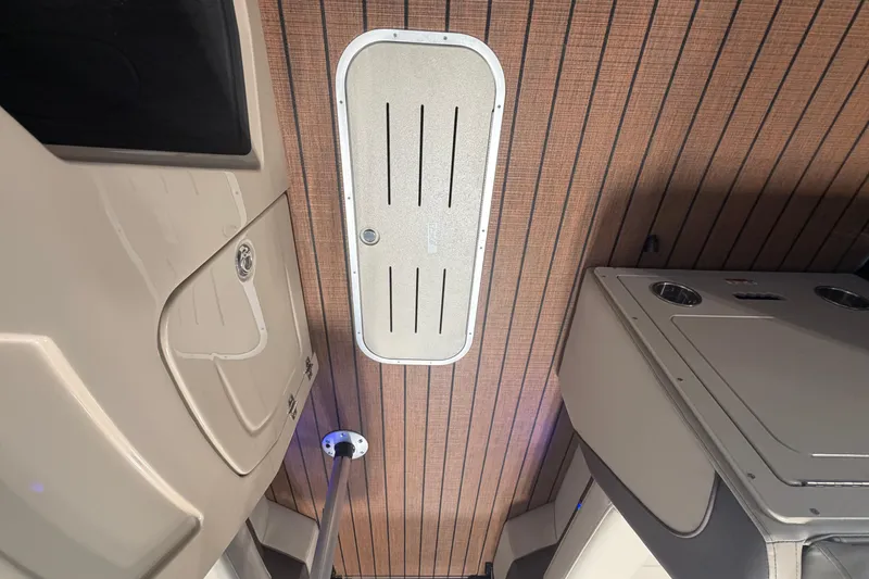 Slide: The Image of Interior view of 2026 Bentley Pontoons Elite 223 Swingback with wood panel ceiling. - 18