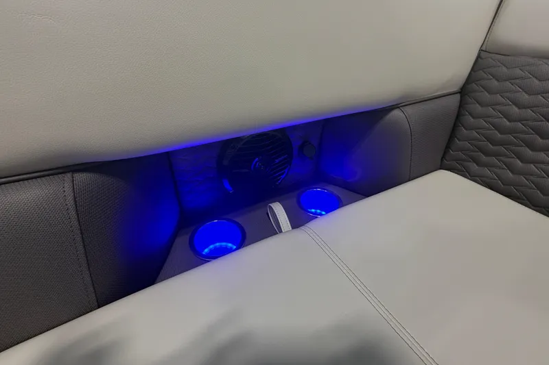 Slide: The Image of 2026 Bentley Pontoons Elite 223 Swingback interior with illuminated cup holders and luxurious seating. - 22