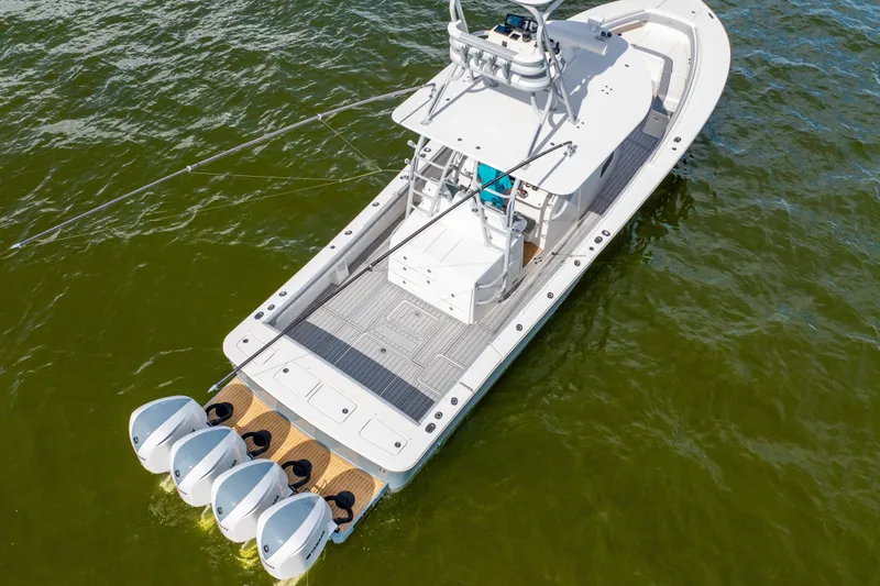 Slide: The Image of 2018 Regulator 41 boat with four engines on green water. - 10