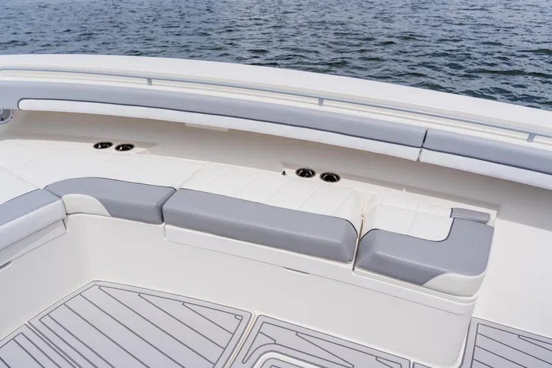 Slide: The Image of 2018 Regulator 41 boat interior with cushioned seating and ocean view. - 105