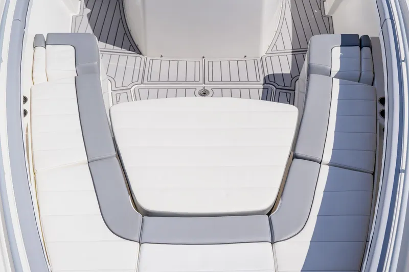 Slide: The Image of 2018 Regulator 41 boat interior with white cushioned seating and sleek design. - 111