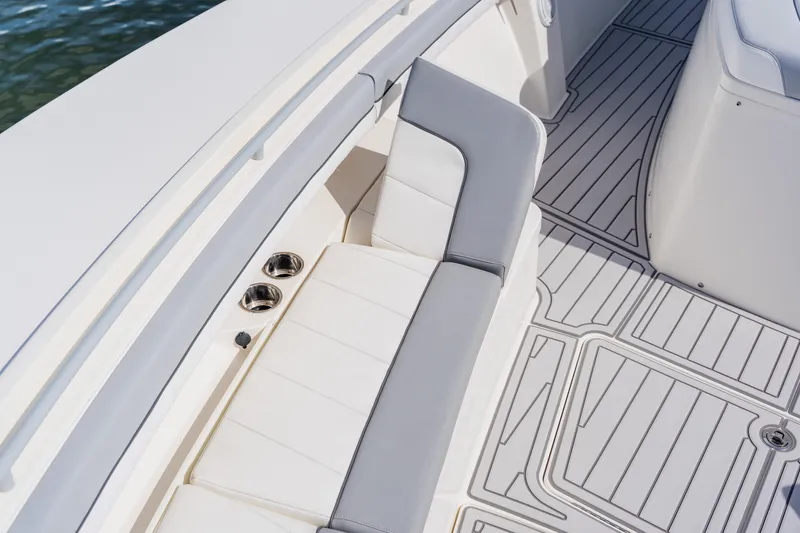 Slide: The Image of 2018 Regulator 41 boat interior with cushioned seating and sleek flooring design. - 114