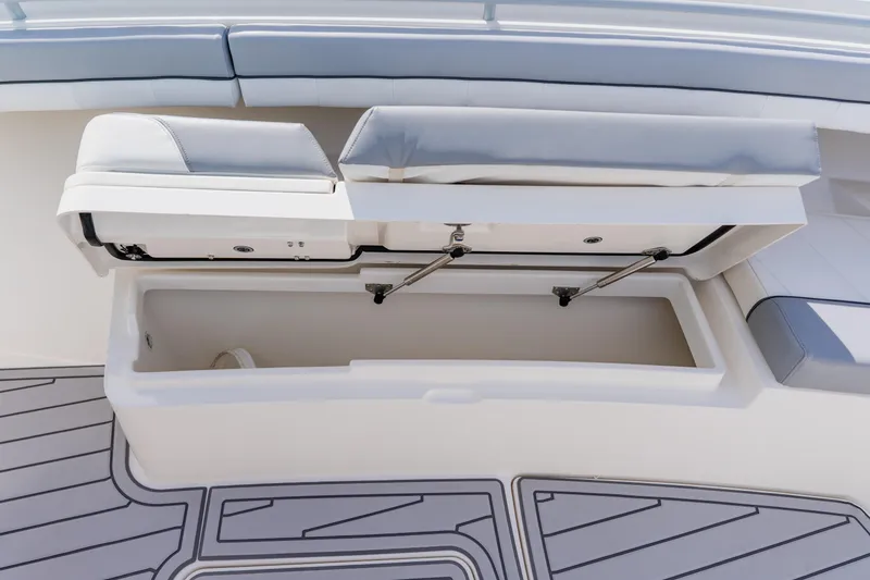 Slide: The Image of Open storage compartment on 2018 Regulator 41 boat with cushioned seating. - 117