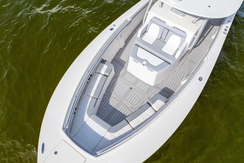 Slide: The Image of 2018 Regulator 41 boat with spacious seating and sleek design on calm water. - 12