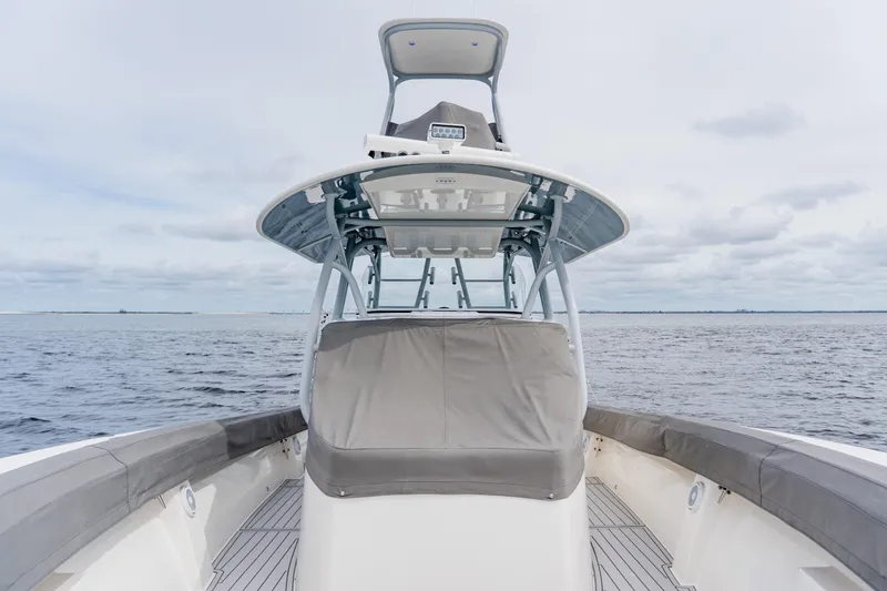Slide: The Image of 2018 Regulator 41 boat on open water, featuring sleek design and spacious deck. - 126