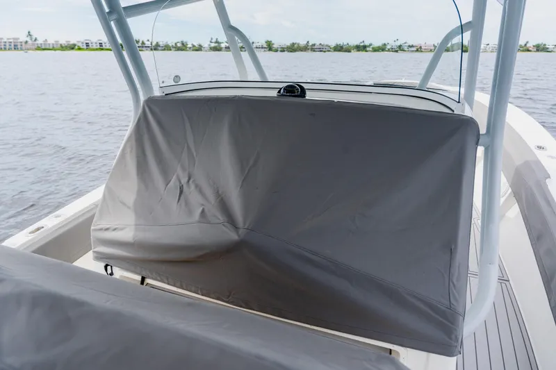Slide: The Image of 2018 Regulator 41 boat with covered console on calm water. - 128