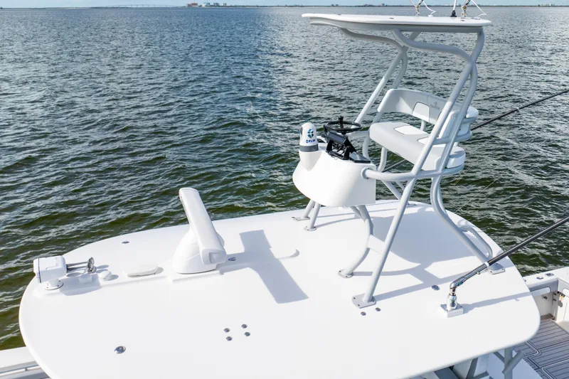 Slide: The Image of 2018 Regulator 41 boat with elevated helm station on open water. - 14