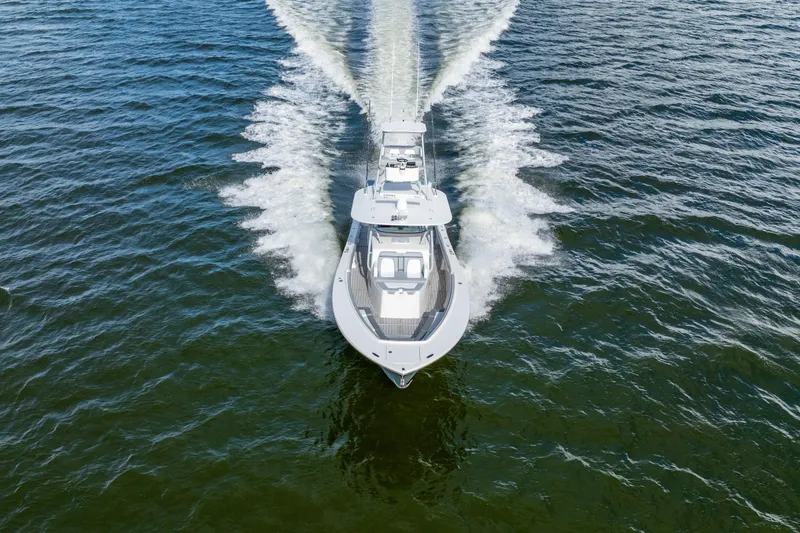 Slide: The Image of 2018 Regulator 41 boat cruising on open water, aerial view. - 20