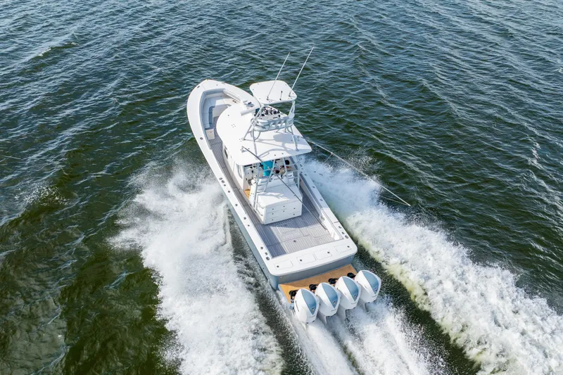 Slide: The Image of Aerial view of 2018 Regulator 41 boat cruising on open water. - 22